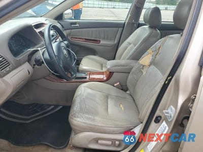 Zdjęcie 7 z 12 samochodu: 2002 TOYOTA CAMRY LE VIN:4T1BF30K32U531159 - miniatura