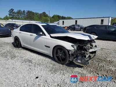 Czwarte zdjęcie samochodu z boku: 2014 BMW 740 I VIN:WBAYA6C58ED144242 - miniatura