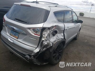 Trzecie zdjęcie samochodu z tyłu: 2014 FORD ESCAPE TITANIUM VIN:1FMCU0J90EUB98640 - miniatura