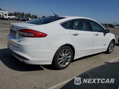 Trzecie zdjęcie samochodu z tyłu: 2017 FORD FUSION SE HYBRID VIN:3FA6P0LU1HR408934 - miniatura