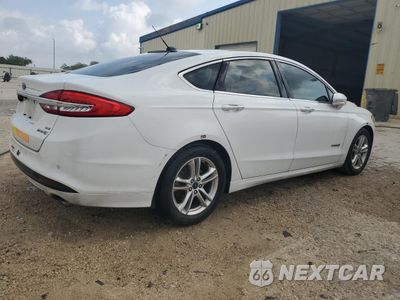 Trzecie zdjęcie samochodu z tyłu: 2018 FORD FUSION SE HYBRID VIN:3FA6P0LU3JR171594 - miniatura