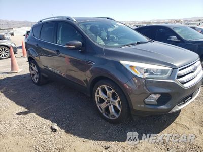 Czwarte zdjęcie samochodu z boku: 2017 FORD ESCAPE TITANIUM VIN:1FMCU0J90HUC14064 - miniatura