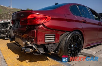 Czwarte zdjęcie samochodu z boku: 2018 BMW M5 VIN:WBSJF0C55JB283553 - miniatura