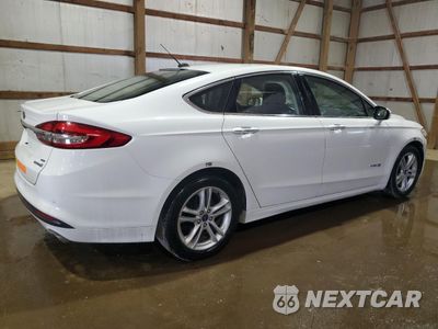 Trzecie zdjęcie samochodu z tyłu: 2018 FORD FUSION SE HYBRID VIN:3FA6P0LU2JR172008 - miniatura