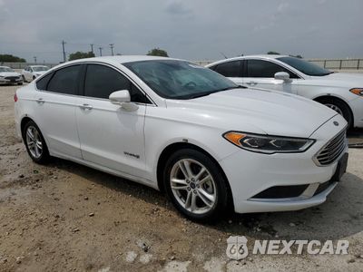 Czwarte zdjęcie samochodu z boku: 2018 FORD FUSION SE HYBRID VIN:3FA6P0LU0JR171889 - miniatura