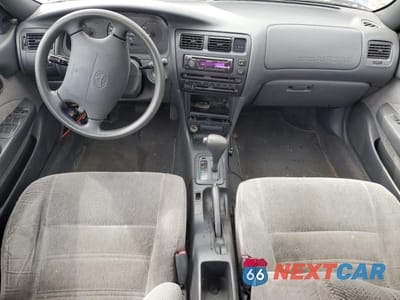 Zdjęcie 8 z 12 samochodu: 1994 TOYOTA COROLLA LE VIN:1NXAE09B0SZ297630 - miniatura