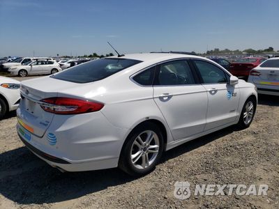 Trzecie zdjęcie samochodu z tyłu: 2018 FORD FUSION SE HYBRID VIN:3FA6P0LU6JR171556 - miniatura