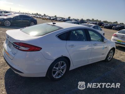 Trzecie zdjęcie samochodu z tyłu: 2018 FORD FUSION SE HYBRID VIN:3FA6P0LU2JR129823 - miniatura