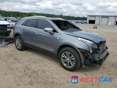 Czwarte zdjęcie samochodu z boku: 2021 CADILLAC XT5 PREMIUM LUXURY VIN:1GYKNCR41MZ116000 - miniatura