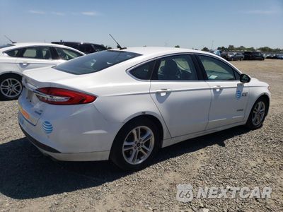 Trzecie zdjęcie samochodu z tyłu: 2018 FORD FUSION SE HYBRID VIN:3FA6P0LU0JR129836 - miniatura
