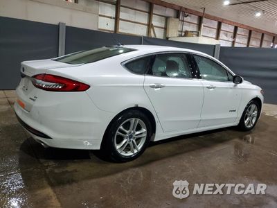 Trzecie zdjęcie samochodu z tyłu: 2018 FORD FUSION SE HYBRID VIN:3FA6P0LU6JR172030 - miniatura