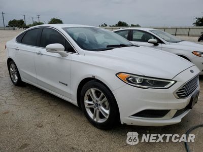 Czwarte zdjęcie samochodu z boku: 2018 FORD FUSION SE HYBRID VIN:3FA6P0LU7JR171890 - miniatura