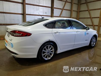 Trzecie zdjęcie samochodu z tyłu: 2017 FORD FUSION SE HYBRID VIN:3FA6P0LU1HR410134 - miniatura
