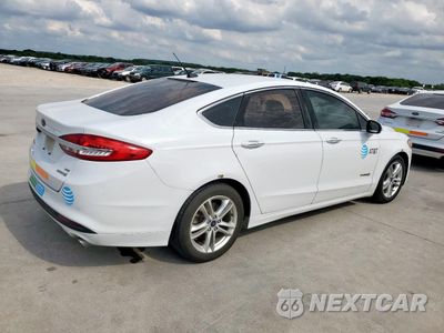 Trzecie zdjęcie samochodu z tyłu: 2018 FORD FUSION SE HYBRID VIN:3FA6P0LU1JR118652 - miniatura