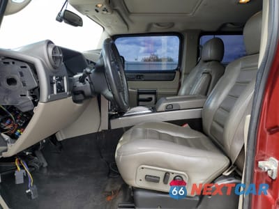 Zdjęcie 7 z 13 samochodu: 2003 HUMMER H2 VIN:5GRGN23U63H142867 - miniatura