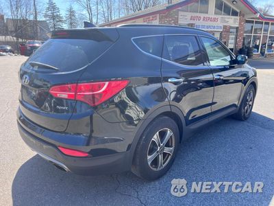 Czwarte zdjęcie samochodu z boku: 2014 HYUNDAI SANTA FE SPORT VIN:5XYZU3LB3EG151846 - miniatura