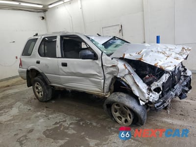 Czwarte zdjęcie samochodu z boku: 2002 ISUZU RODEO S VIN:4S2DM58W924331185 - miniatura