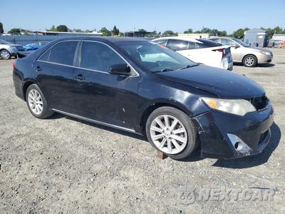 Czwarte zdjęcie samochodu z boku: 2012 TOYOTA CAMRY HYBRID VIN:4T1BD1FK0CU018017 - miniatura