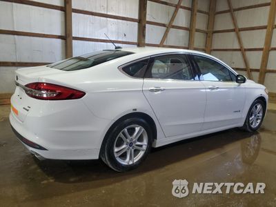 Trzecie zdjęcie samochodu z tyłu: 2018 FORD FUSION SE HYBRID VIN:3FA6P0LU6JR281927 - miniatura