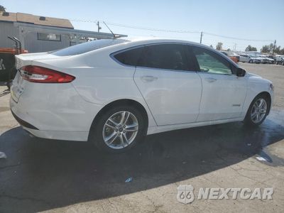 Trzecie zdjęcie samochodu z tyłu: 2018 FORD FUSION SE HYBRID VIN:3FA6P0LU8JR118664 - miniatura
