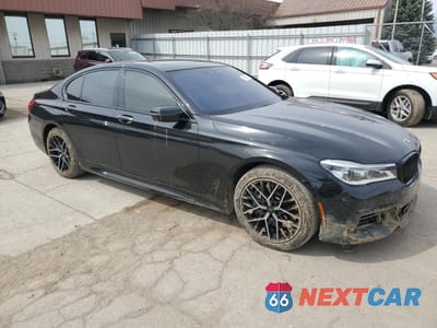 Czwarte zdjęcie samochodu z boku: 2018 BMW 750 XI VIN:WBA7B0C59JG527248 - miniatura