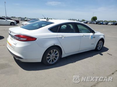 Trzecie zdjęcie samochodu z tyłu: 2018 FORD FUSION SE HYBRID VIN:3FA6P0LU4JR129824 - miniatura