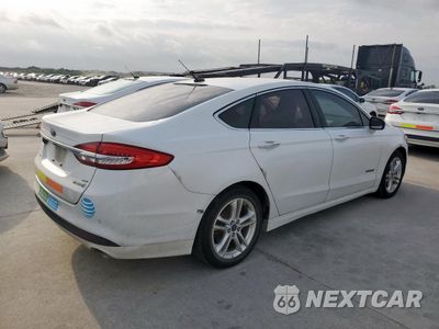 Trzecie zdjęcie samochodu z tyłu: 2018 FORD FUSION SE HYBRID VIN:3FA6P0LU2JR118661 - miniatura