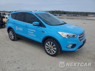 Czwarte zdjęcie samochodu z boku: 2017 FORD ESCAPE TITANIUM VIN:1FMCU9JD8HUE56318 - miniatura