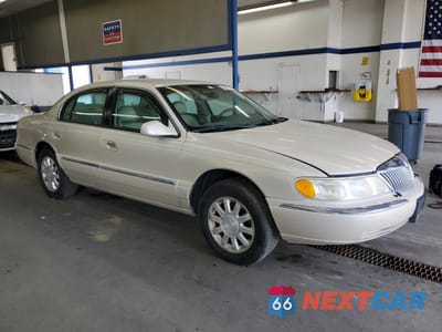 Czwarte zdjęcie samochodu z boku: 1999 LINCOLN CONTINENTAL VIN:1LNHM97V9XY667718 - miniatura
