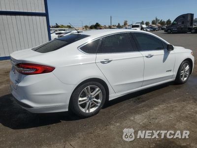 Trzecie zdjęcie samochodu z tyłu: 2018 FORD FUSION SE HYBRID VIN:3FA6P0LU6JR171590 - miniatura