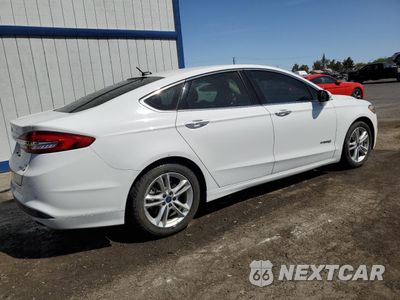 Trzecie zdjęcie samochodu z tyłu: 2018 FORD FUSION SE HYBRID VIN:3FA6P0LU0JR171598 - miniatura