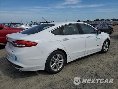 Trzecie zdjęcie samochodu z tyłu: 2018 FORD FUSION SE HYBRID VIN:3FA6P0LU7JR171548 - miniatura
