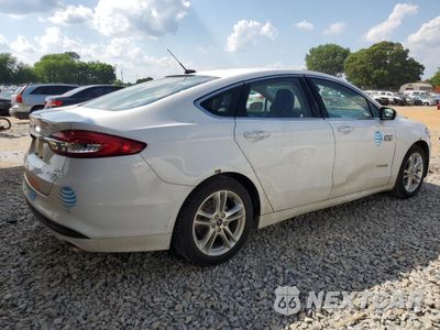 Trzecie zdjęcie samochodu z tyłu: 2018 FORD FUSION SE HYBRID VIN:3FA6P0LU6JR129940 - miniatura
