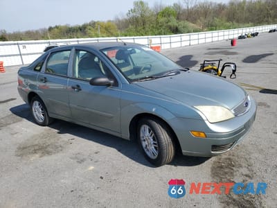 Czwarte zdjęcie samochodu z boku: 2004 FORD FOCUS ZX4 VIN:1FAHP34N06W142317 - miniatura