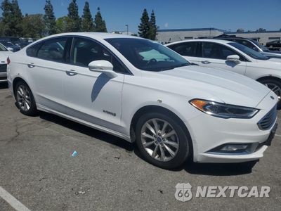 Czwarte zdjęcie samochodu z boku: 2017 FORD FUSION SE HYBRID VIN:3FA6P0LU2HR409316 - miniatura