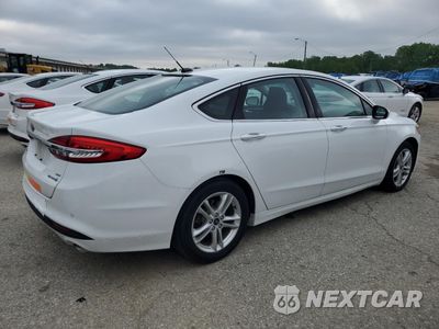 Trzecie zdjęcie samochodu z tyłu: 2018 FORD FUSION SE HYBRID VIN:3FA6P0LU7JR129915 - miniatura