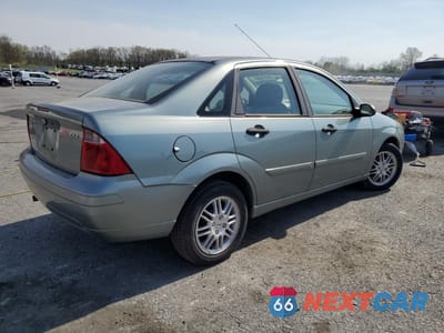 Trzecie zdjęcie samochodu z tyłu: 2004 FORD FOCUS ZX4 VIN:1FAHP34N06W142317 - miniatura