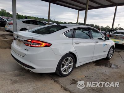 Trzecie zdjęcie samochodu z tyłu: 2018 FORD FUSION SE HYBRID VIN:3FA6P0LU0JR163534 - miniatura