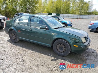 Czwarte zdjęcie samochodu z boku: 1999 VOLKSWAGEN JETTA GL VIN:3VWRA29M3XM106405 - miniatura