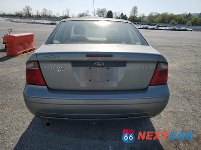 Zdjęcie 6 z 12 samochodu: 2004 FORD FOCUS ZX4 VIN:1FAHP34N06W142317 - miniatura