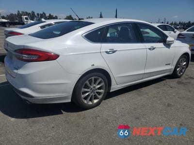 Trzecie zdjęcie samochodu z tyłu: 2017 FORD FUSION SE HYBRID VIN:3FA6P0LU5HR409312 - miniatura