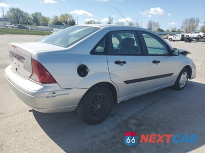 Trzecie zdjęcie samochodu z tyłu: 2003 FORD FOCUS LX VIN:1FAFP33P23W311601 - miniatura