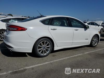 Trzecie zdjęcie samochodu z tyłu: 2017 FORD FUSION SE HYBRID VIN:3FA6P0LU3HR409700 - miniatura