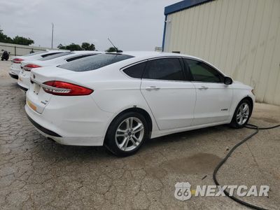 Trzecie zdjęcie samochodu z tyłu: 2018 FORD FUSION SE HYBRID VIN:3FA6P0LU0JR171892 - miniatura