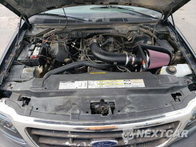 Zdjęcie 12 z 14 samochodu: 1999 FORD F150 VIN:1FTRX18W4XNA46073 - miniatura