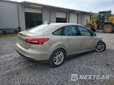 Trzecie zdjęcie samochodu z tyłu: 2016 FORD FOCUS SE VIN:1FADP3F26GL385585 - miniatura