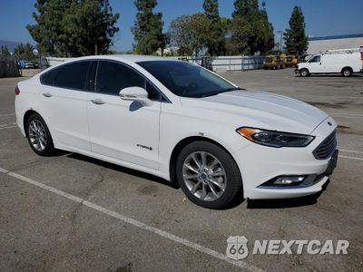 Czwarte zdjęcie samochodu z boku: 2017 FORD FUSION SE HYBRID VIN:3FA6P0LU8HR408896 - miniatura