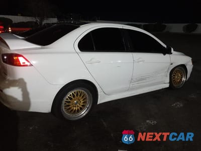 Trzecie zdjęcie samochodu z tyłu: 2012 MITSUBISHI LANCER ES/ES SPORT VIN:JA32U2FU7CU007655 - miniatura