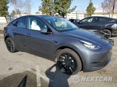 Czwarte zdjęcie samochodu z boku: 2023 TESLA MODEL Y VIN:7SAYGDEE4PA154815 - miniatura