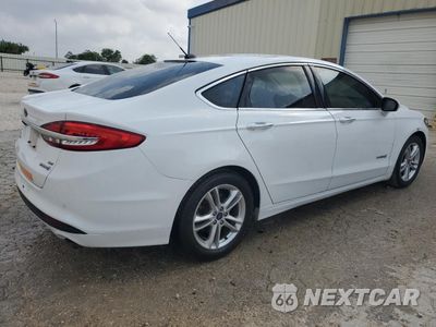 Trzecie zdjęcie samochodu z tyłu: 2018 FORD FUSION SE HYBRID VIN:3FA6P0LU1JR171819 - miniatura